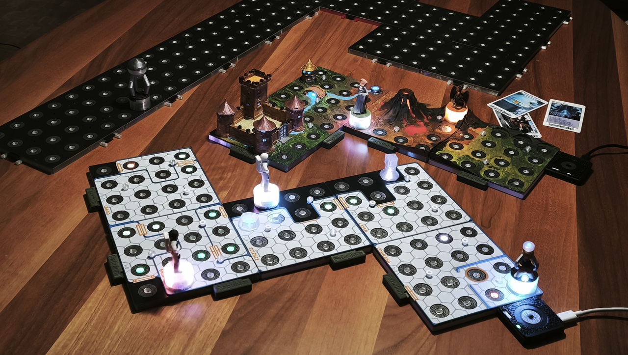 FABULUM on the table: white play tiles, painted terrain, and spare modules