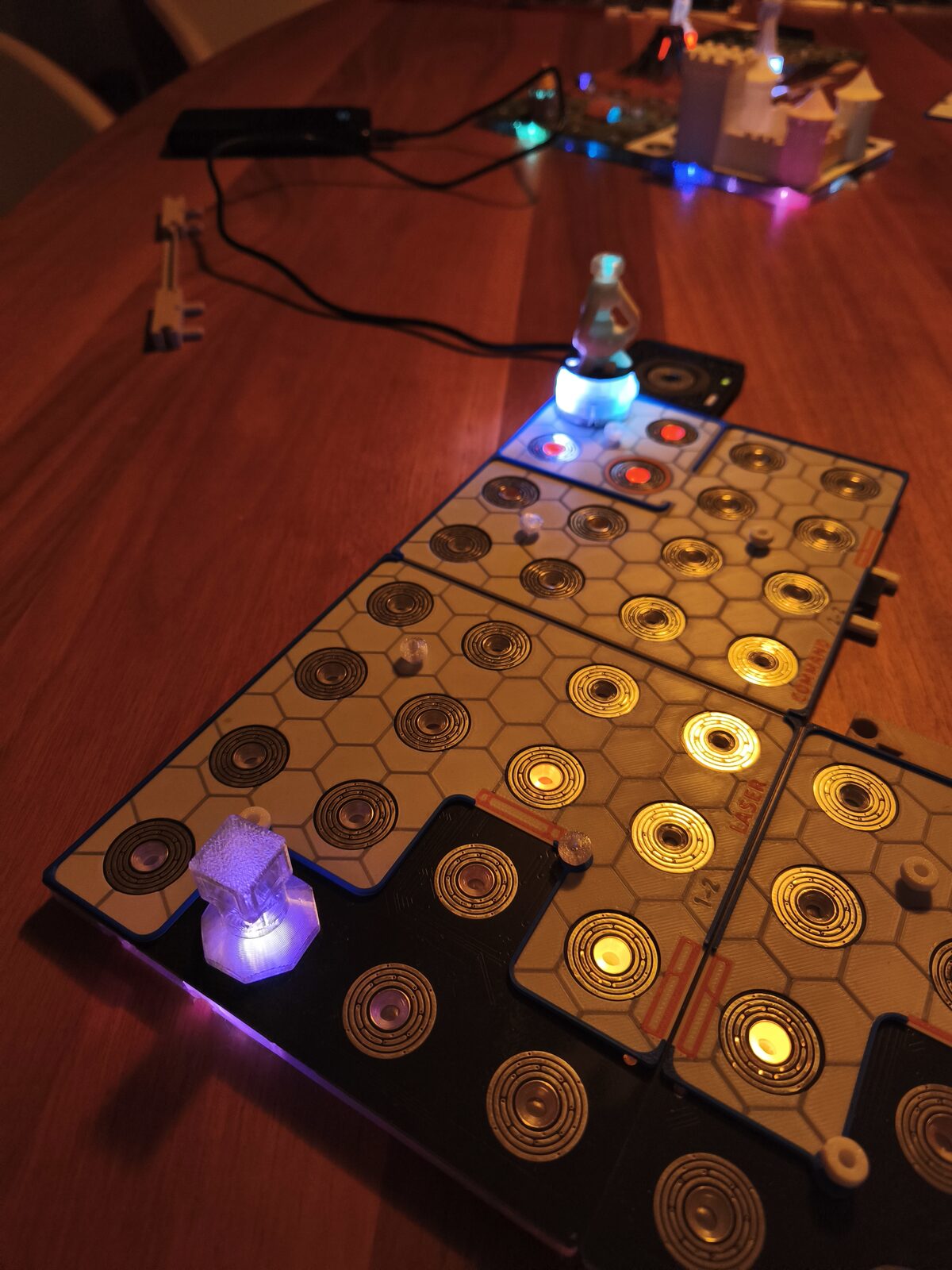 Lit hex tiles and a token on the FABULUM board